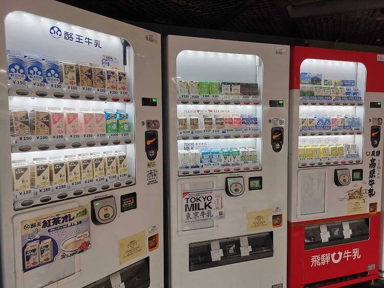 A wall of colorful flavored drinks in a Tokyo vending machine